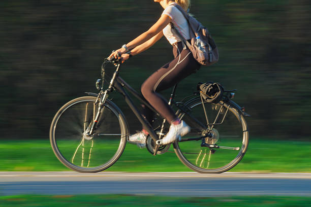 istock Woman Cycling - Blurred Motion 488119571