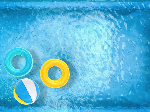 istock pool top view with swim rings and beach ball 488119752