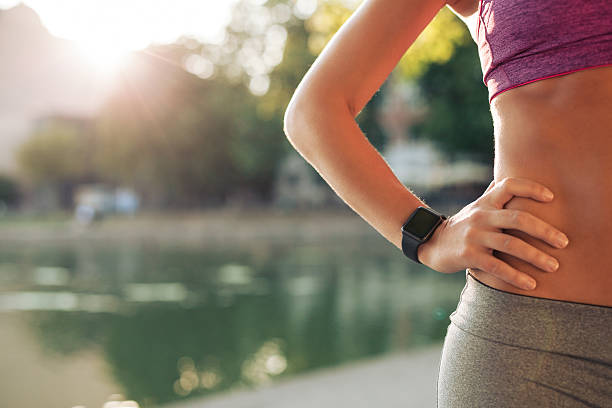 istock Sportswoman wearing smartwatch 488120334