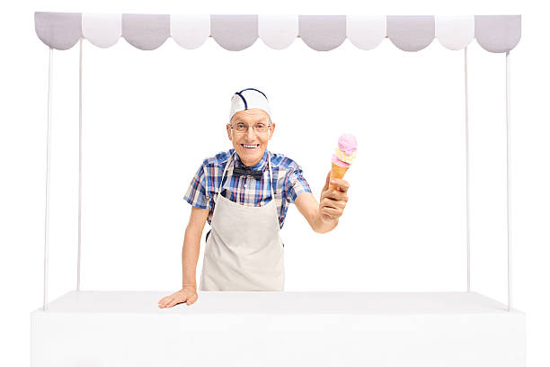 Senior vendor giving an ice cream