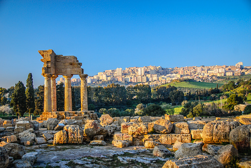Ruins of Temple of Castor and Pollux with Agrigento, Sicily in the background