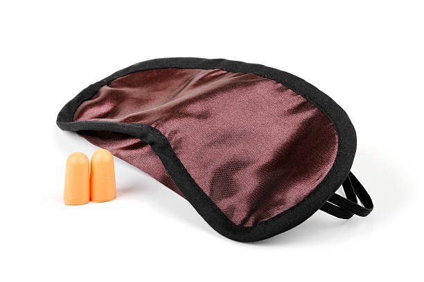 istock sleeping mask and earplugs isolated on white 488120730