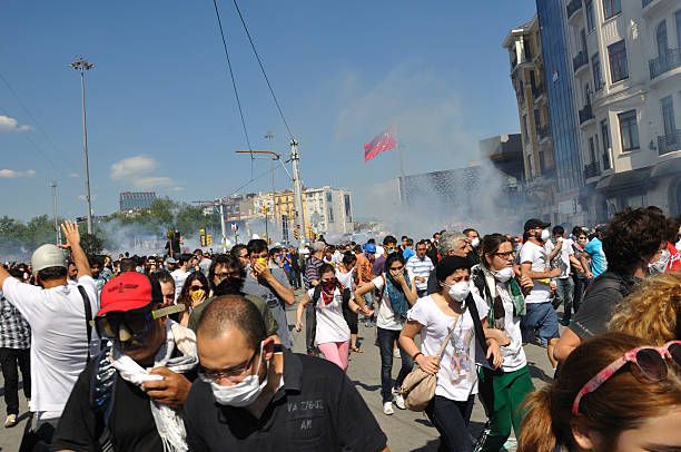 Gezi Park Protests, Istanbul Istanbul, Turkey - June 01, 2013: Tear gas capsules fired by Turkish police towards the protesters during the Gezi Park Protests, Taksim Square, Istanbul riot tear gas stock pictures, royalty-free photos & images