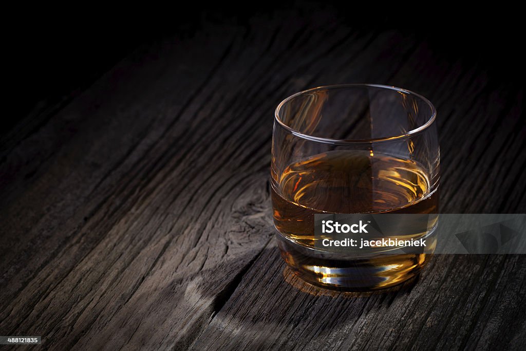 Glass of whisky Glass of luxury single malt whiskey. Drink concept photography taken on old wooden table. Alcohol - Drink Stock Photo
