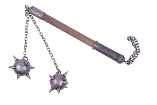 Flail with spiked balls displayed by diagonal, isolated on white background.