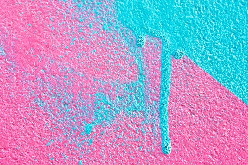 Pink and blue paint on a wall
