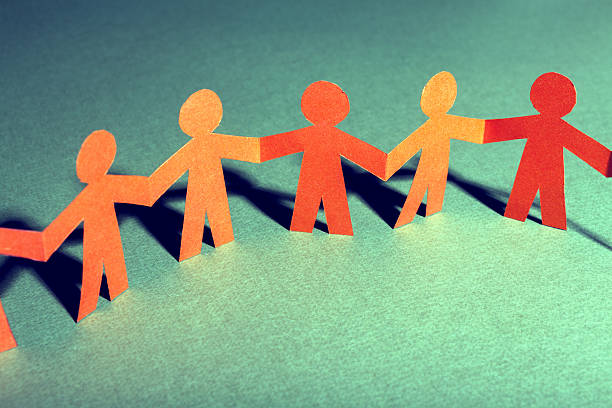 istock Paper team linked together partnership concept 488122781