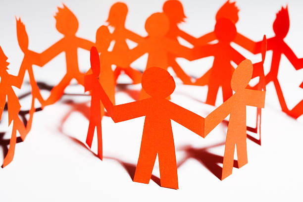 istock Paper team linked together partnership concept 488123001