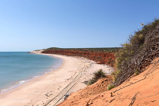 istock Bottle Bay with Red Soil Formations and White Sandy Beach 488143050