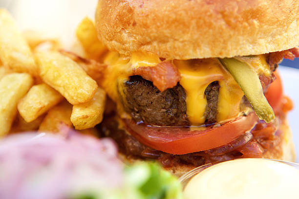 istock Bacon and cheese hamburger with fries 488143988