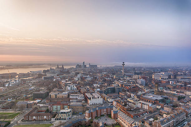 Liverpool Sunset Liverpool - England, Urban Scene, City, Sunset, Urban Skyline, UK, Orange Color, Sky, Dawn, Tower, England, Travel Locations, Rise And Shine, Europe, Silhouette, Sunlight, Symbol, Sunrise - Dawn, Cityscape, Light - Natural Phenomenon, Cloud - Sky, Sun, Built Structure, Balcony, Roof, Street, Monument, Aerial View, Horizontal, Beautiful, Royal Liver Building, Sculpture, Dusk, Downtown District, City Life, Cloudscape, Building Exterior, Tourism, Travel, Traffic, Skyscraper, Outdoors, Architecture, Famous Place, English Culture, On Top Of, Modern, Old, History, Illuminated, Beauty, River Mersey - Northwest England liverpool england stock pictures, royalty-free photos & images