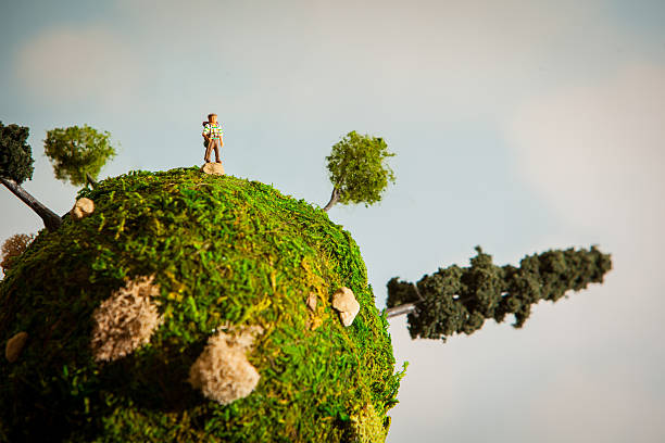 Diorama depicting a hiker on a miniature earth stock photo