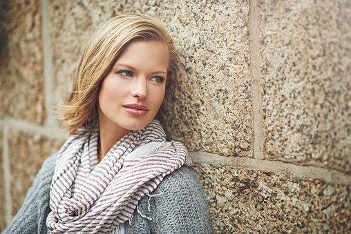 Cropped shot of an attractive young woman leaning against a brick wallhttp://195.154.178.81/DATA/i_collage/pi/shoots/782761.jpg