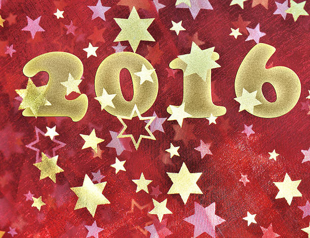 istock Year 2016 on red fabric with stars 488151526
