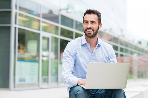 istock Businessman with laptop oudoor 488152982
