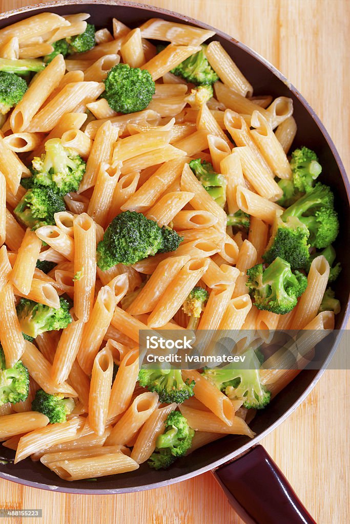 Penne with broccoli Penne with broccoli and cream, cooked in frying pan Broccoli Stock Photo