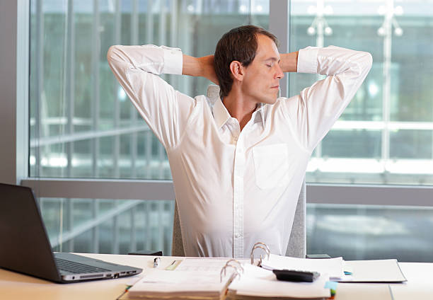 istock white collar worker male stretching arms, relaxing neck 488155254