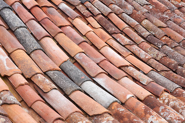 istock Old clay tile roof detail in horizontal format 488155654