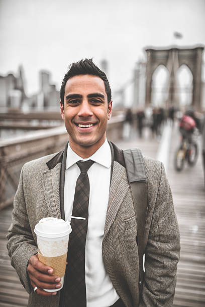 istock Businessman with coffee mug in brooklyn bridge 488158765