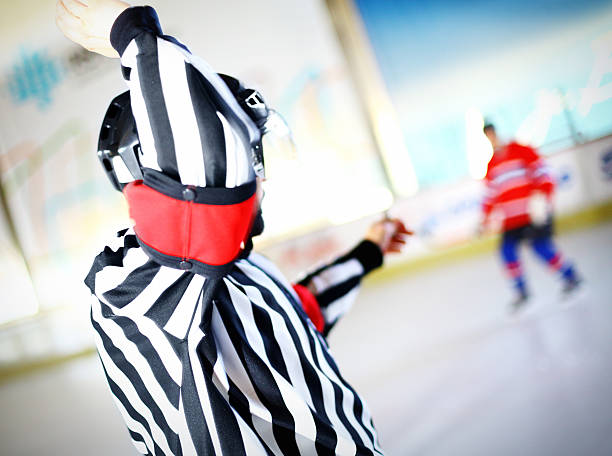 istock Ice hockey referee calls delayed penalty. 488159873