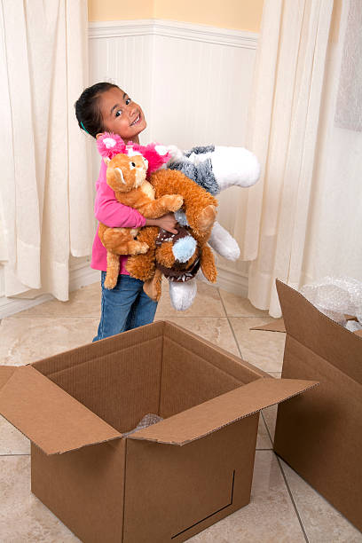 istock Little girl unpacking in a new home 488160661