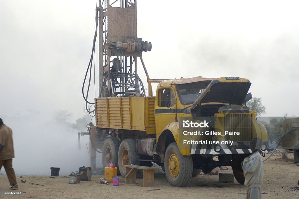 Drilling of a well in Burkina Faso Liguidimalgem, Burkina Faso - February 24, 2007: In Africa water is in-depth, it is necessary to make a drilling. The fine dust released by drilling is now unbearable Africa Stock Photo