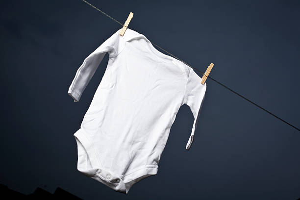 istock White baby grow on a washing line 488177817