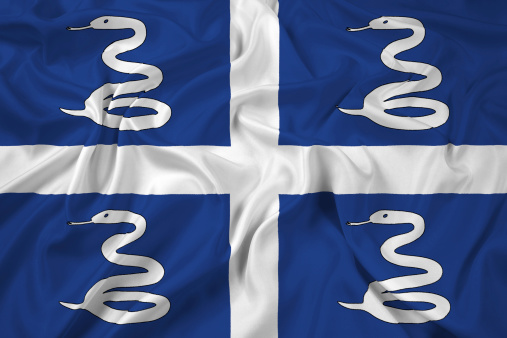 Flag of the city of Vannes waving un mid air.