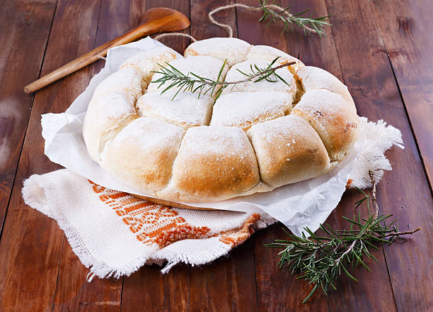 Freshly baked Australian damper loaf on wooden background stock photo