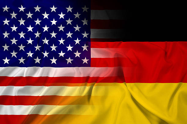 Waving USA and Germany Flag stock photo