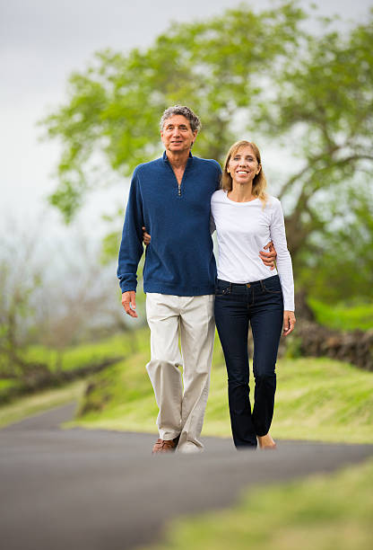 istock Mature middle age couple in love walking 488180555