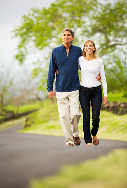 istock Mature middle age couple in love walking 488180559
