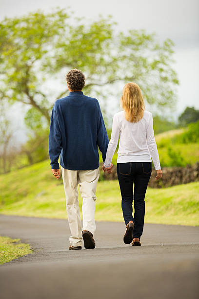 istock Mature middle age couple in love walking 488180565