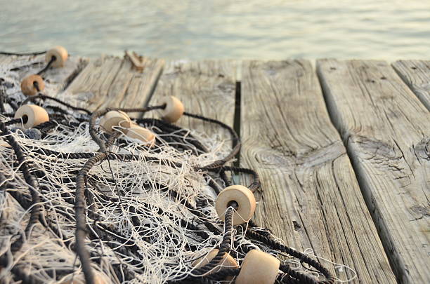 Fisher net on Jetty Fisher net on Pier commercial fishing net photos stock pictures, royalty-free photos & images