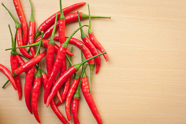 istock Bowl of hot chilli peppers with copy space 488200769