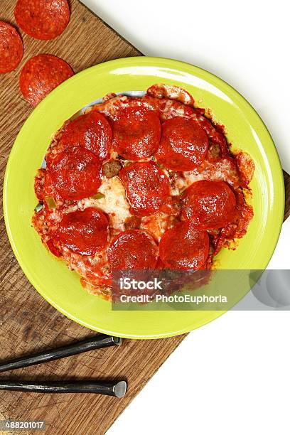 Microwaved Frozen Pizza On Table Stock Photo - Download Image Now - Cheese, Convenience Food, Cooked