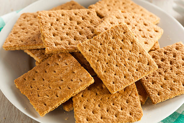 Healthy Honey Graham Crackers Healthy Honey Graham Crackers on a Plate Graham Cracker stock pictures, royalty-free photos & images