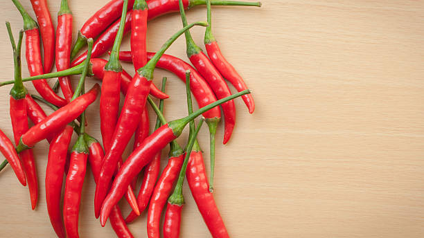 istock Bowl of hot chilli peppers with copy space 488201059