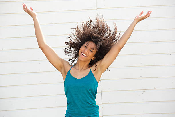 istock Woman smiling with arms spread open 488202845