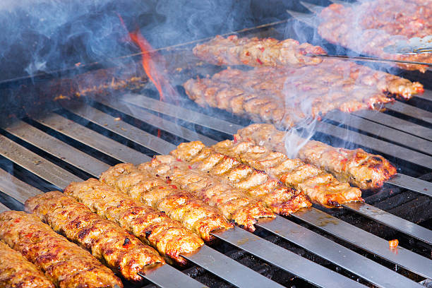 istock Cooking Adana Lamb Kebabs on the Restaurant Style Grill 488203963