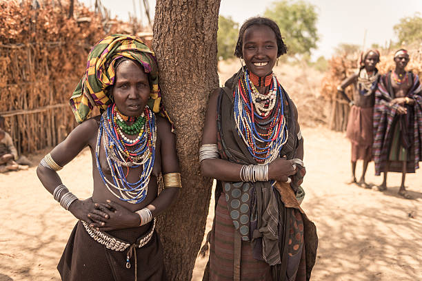 Unidentified Arbore Women, Omo valley Turmi, Ethiopia - August 16, 2015: two unidentified women from Arbore tribe. Arbore tribe people are endangered because of oil field near their villages. omo river photos stock pictures, royalty-free photos & images