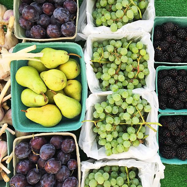 Fall fruit in baskets at farmer's market table, Okanagan, Canada