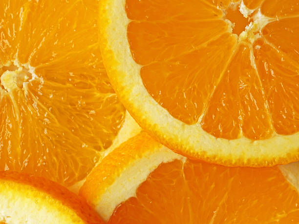 istock background of sliced oranges close up 488209398