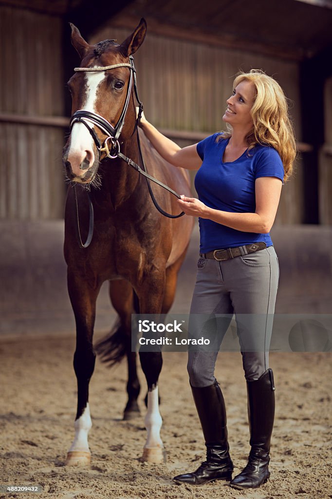 woman stroking horse Horse Stock Photo