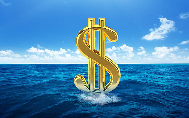 istock Dollar symbols on sea/water/ocean 488209534