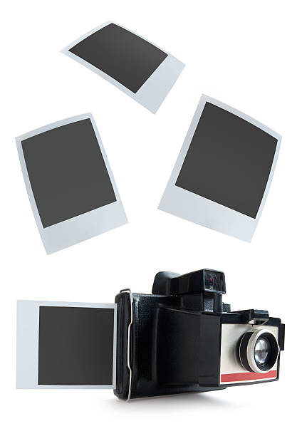 Instant camera photos Polaroid instant camera with photos moving down photos stock pictures, royalty-free photos & images