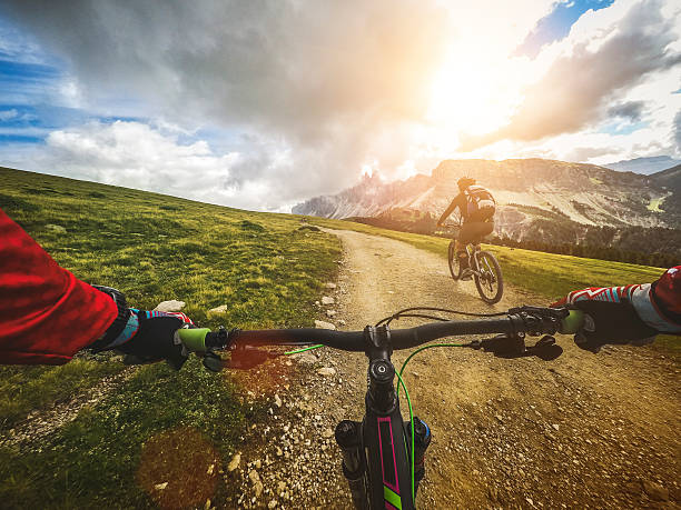 Mountain Bike: Single Trail in two DCIM100GOPROG0039423.Riding a mountain bike on the Alps: point of view camera filming. mountain biking stock pictures, royalty-free photos & images