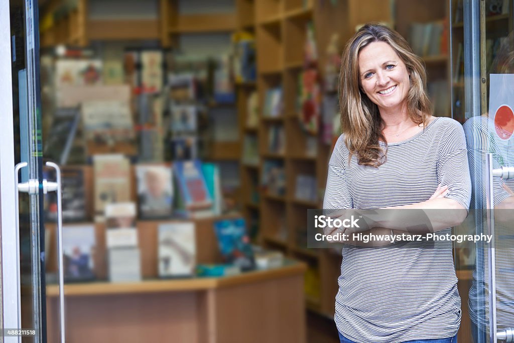 Portrait Of Female Bookshop Owner Outside Store Bookstore Stock Photo