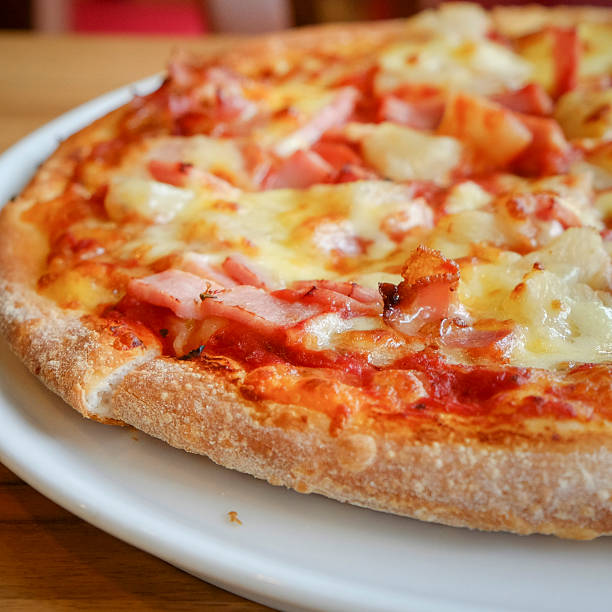 istock delicious hawaiian rustic style pizza made with fresh pineapples 488212626