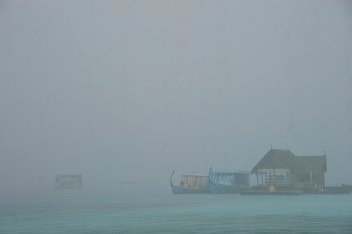 pier in the rain, Maldives.